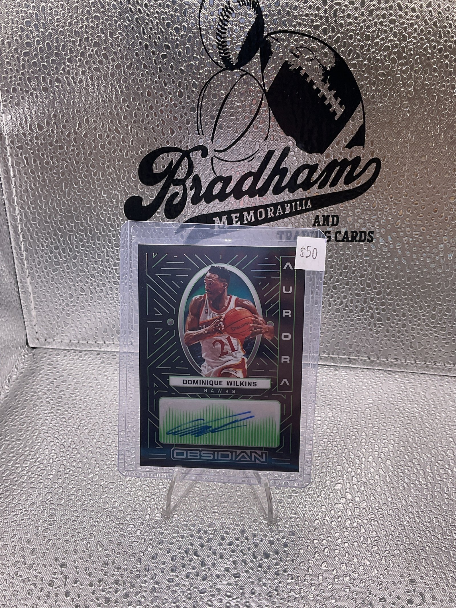 29920CC9-1DA8-4429-936E-8AF191F2FFBD 2021-22 Panini Obsidian Dominique Wilkins Aurora Green Etch Auto /25
#AUR-DWL - Image 1