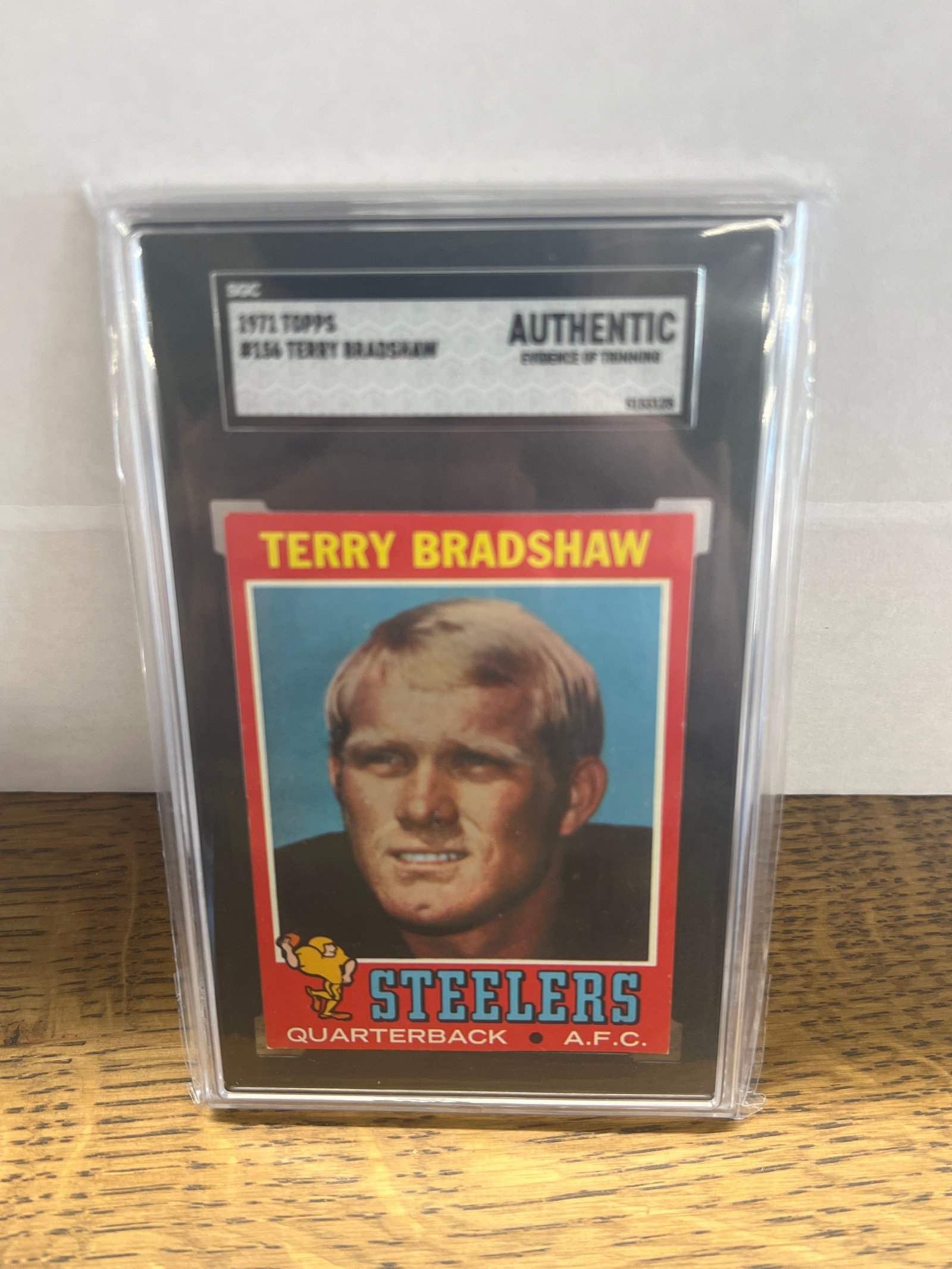 4DB9DF6F-45E5-42A1-8BAA-68E325C7C572 1971 Topps Football Terry Bradshaw HOF Rookie #156 SGC Authentic - Newly Graded - Image 1