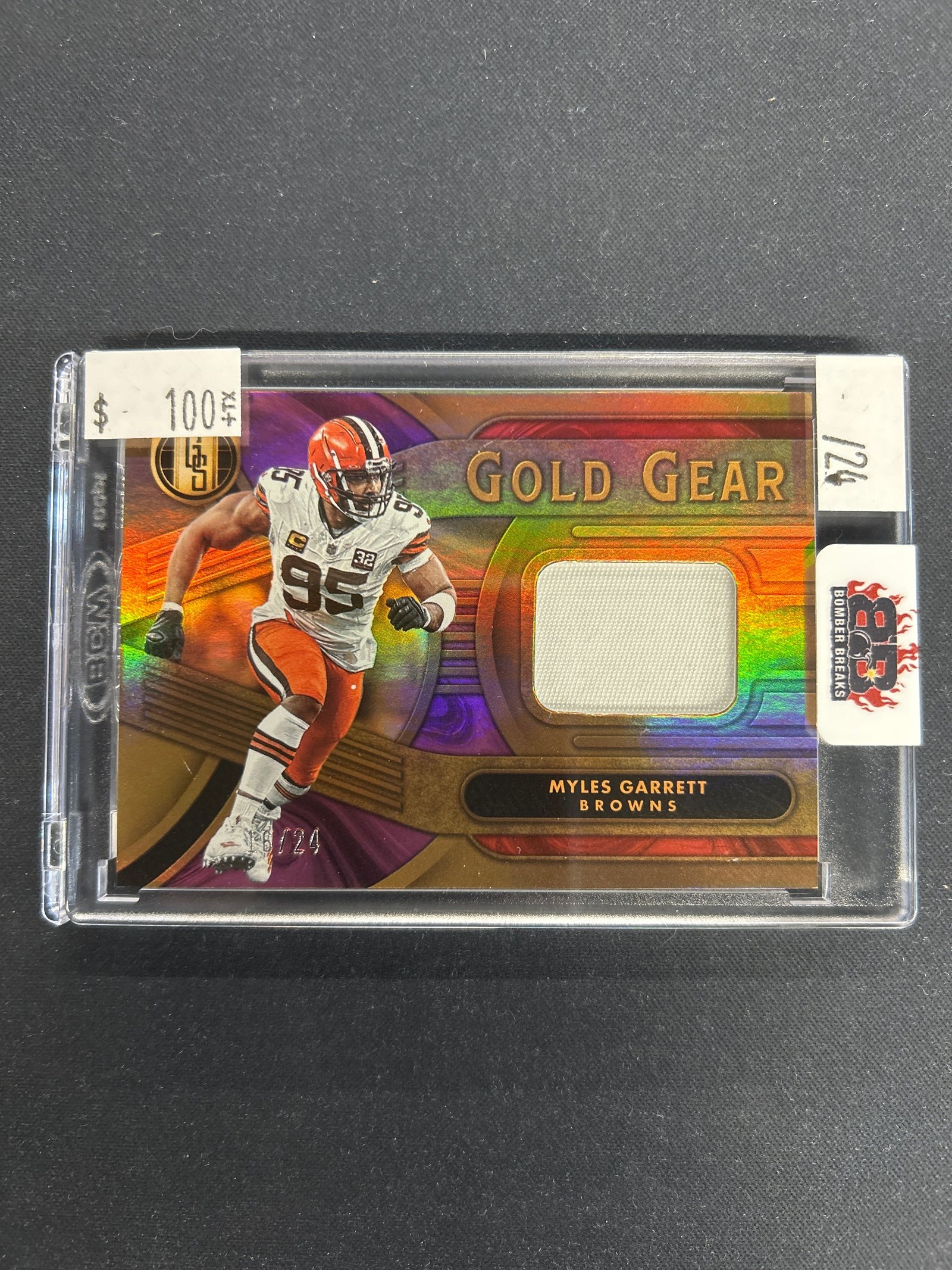 B6BECD54-6B3E-4328-9E0F-1B6A0B89265C Myles Garrett 2024 Panini Gold Standard Gold Gear /24 #GG-MGT - Image 1